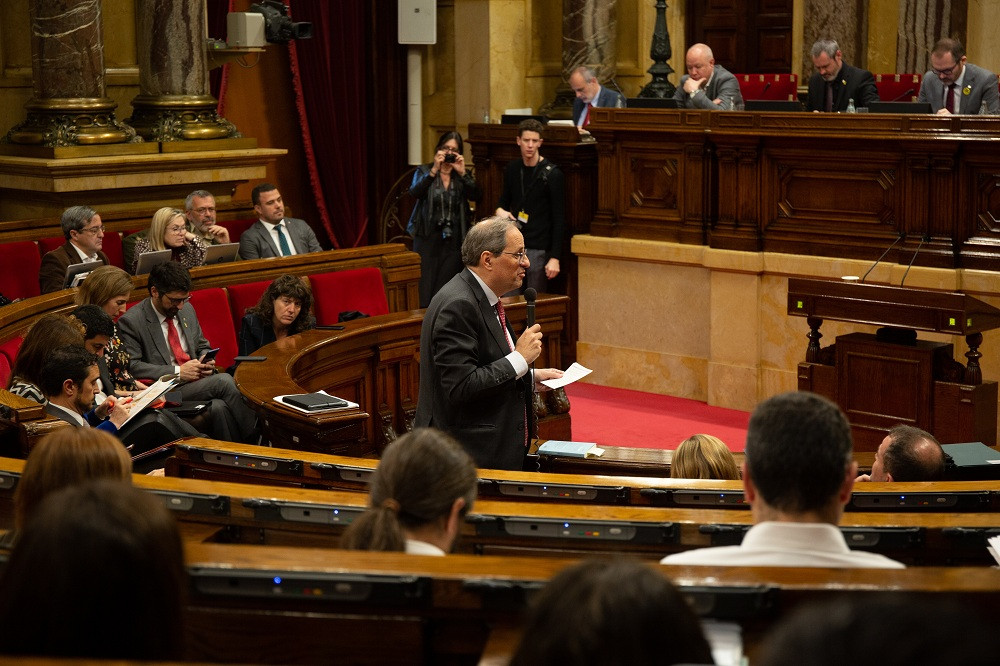 Torra  interviene desde su escaño