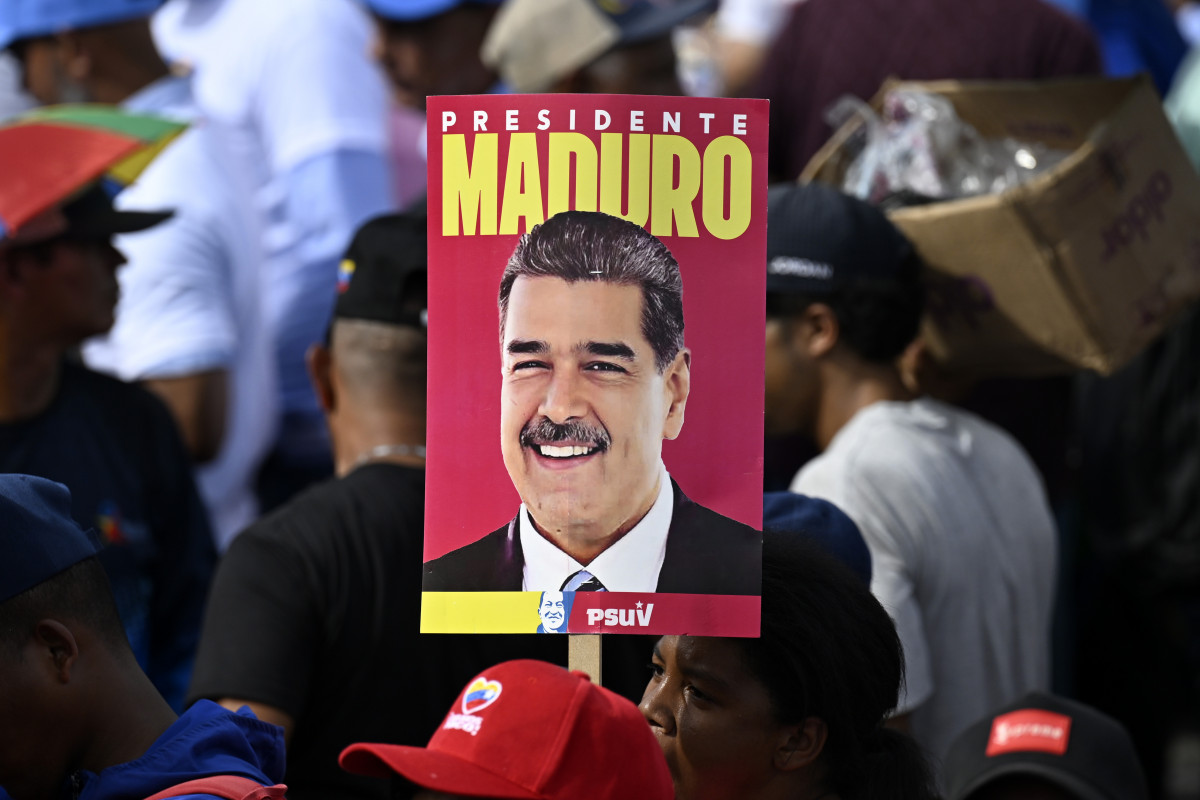 EuropaPress 6113564 caracas july 26 2024    supporter holds poster of venezuelan president