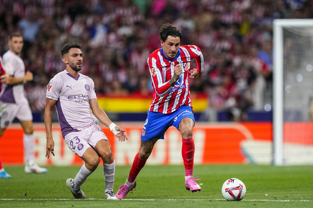 EuropaPress 6173779 jose maria gimenez of atletico madrid and ivan martin in action during the