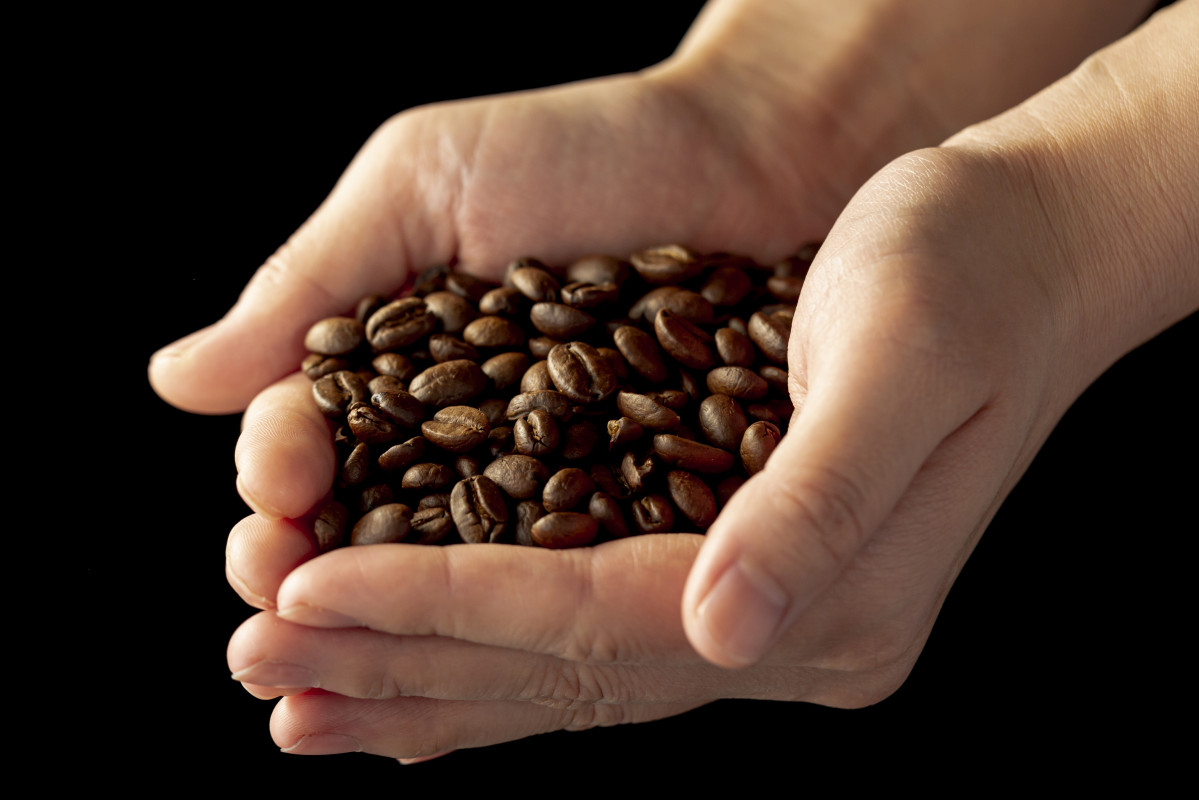 Coffee beans mans hands